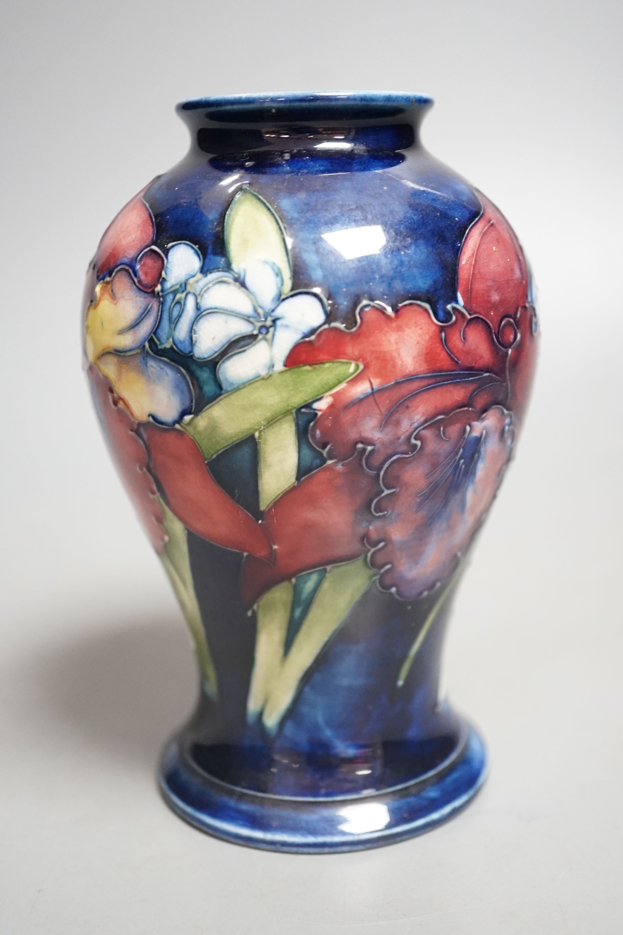 A Moorcroft orchid pattern vase - 15cm tall